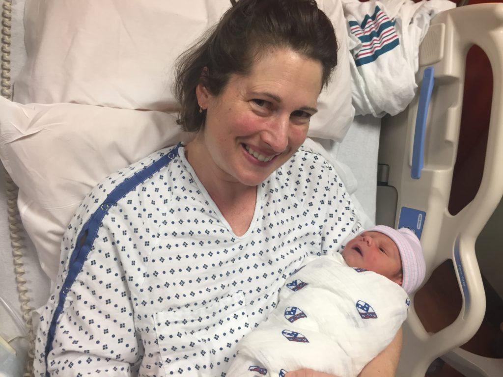 MFS English teacher Claire MacKenzie poses with Jamie MacKenzie, the first baby born in 2017 in Philadelphia. 