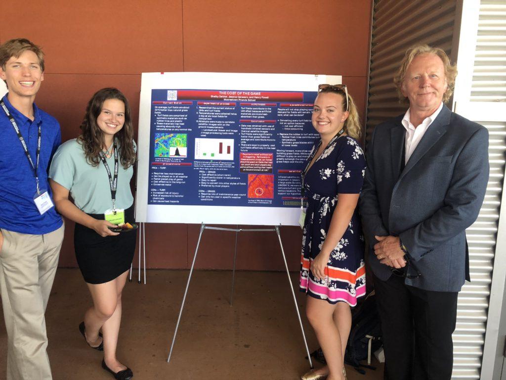 Henry Powell ‘20, Jessica Cerasaro ‘20, Shelby Deibler, ‘20, and John Trunkwalter in front of their project. The Satellite and Education conference took place in Los Angeles, California, in July. Photo courtesy Shelby Deibler