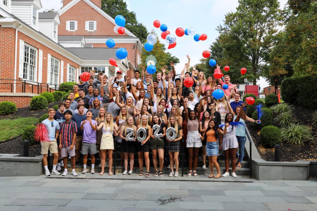 Class of 2020 pose outside of Stokes Hall
