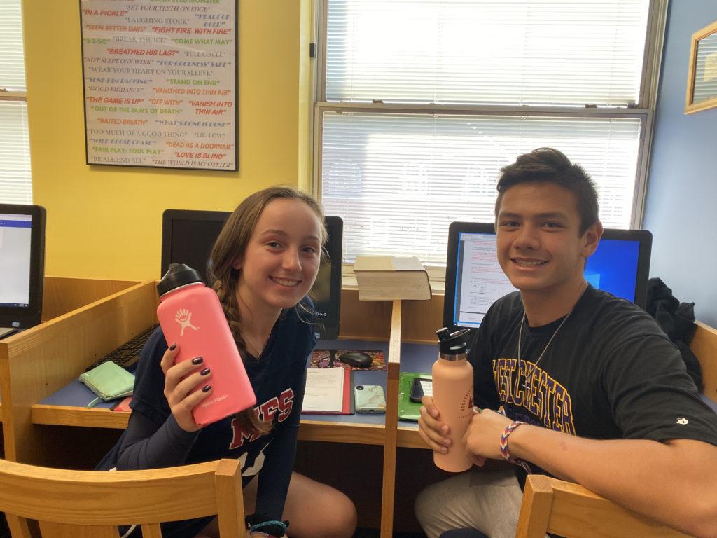 Bella Prate '21 and Alex Boller '20 stay hydrated on Water Wednesday. 