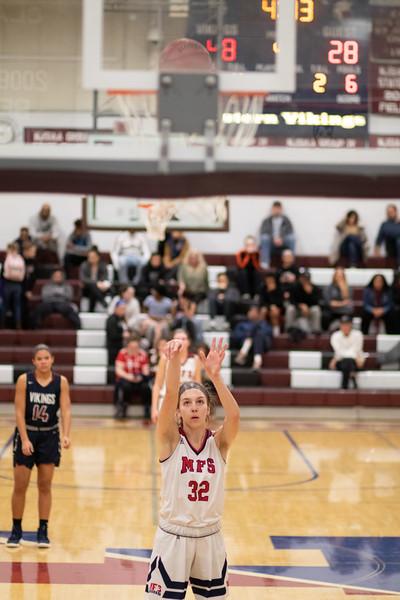 Bella Runyan, class of ’20, playing basketball last season (18-19) 
Photo Credit: Andrew Rowan '19