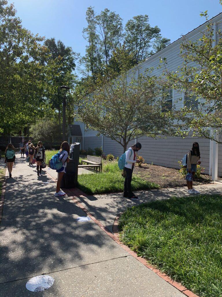 Photo by Lauren Edelstien '22. Athletes waiting in line to change into their athletic attire.