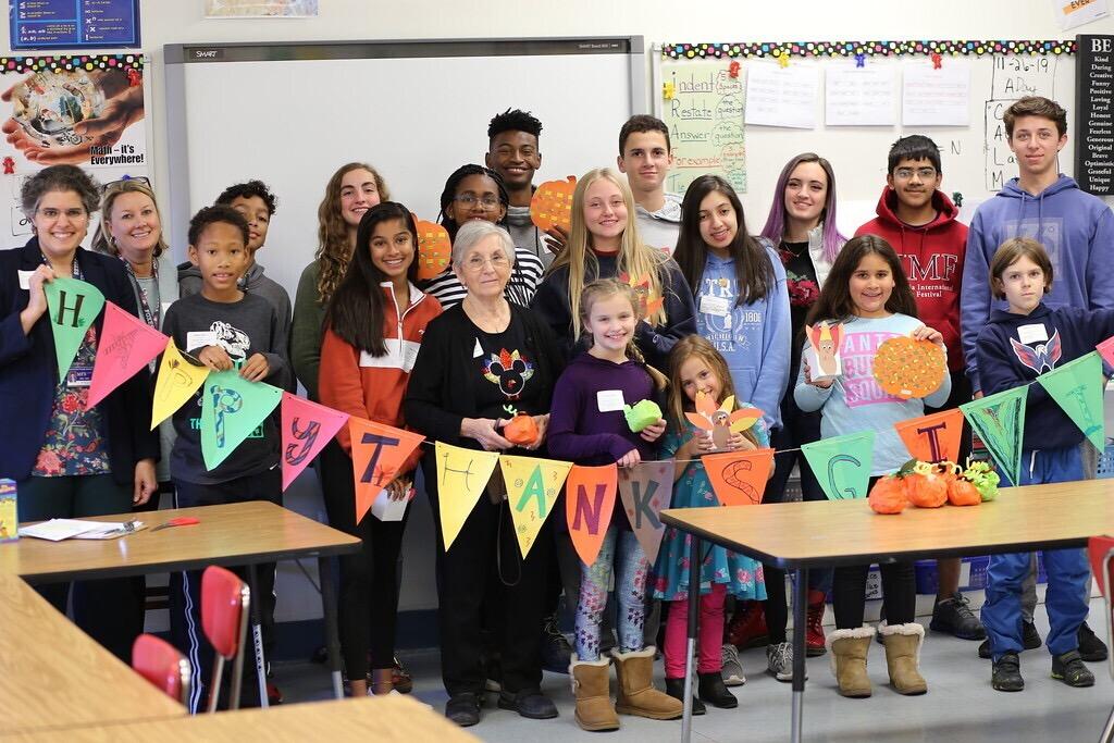 2019-20 Thanksgiving Happening group poses together while displaying crafts. Photo by Sam Bitman ’21.