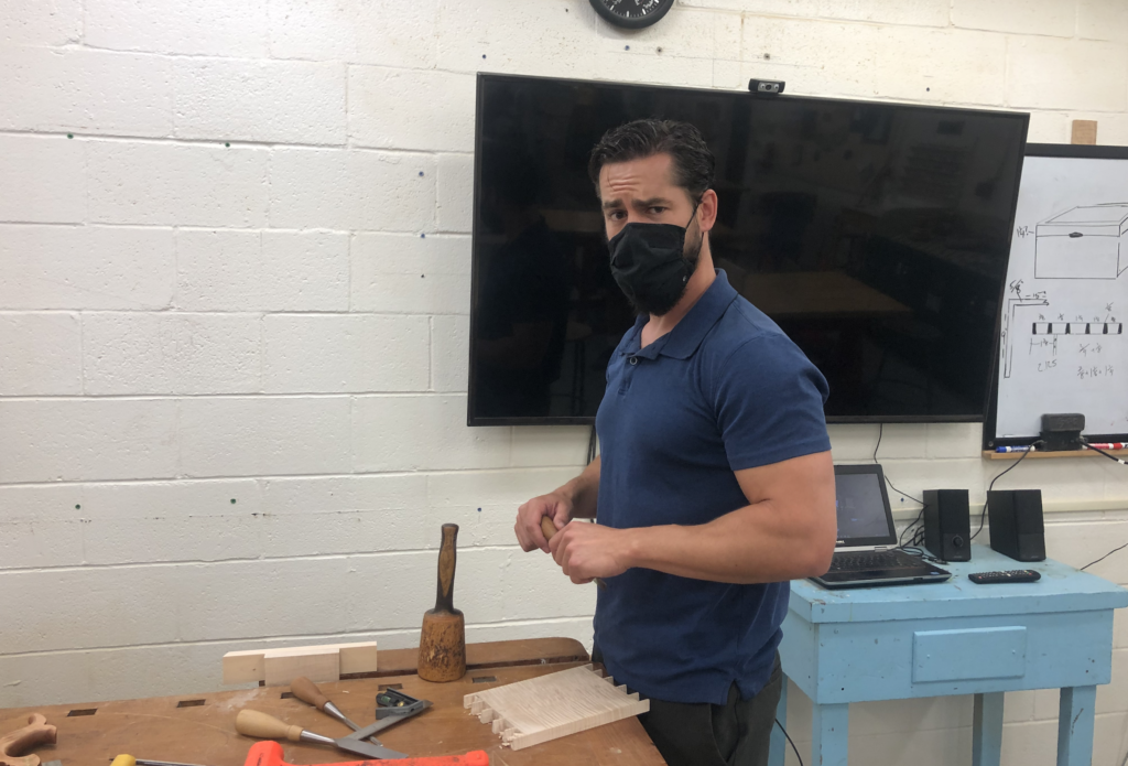 Erik Curtis working on a project in the woodshop. Photo by Emma Nei '22.