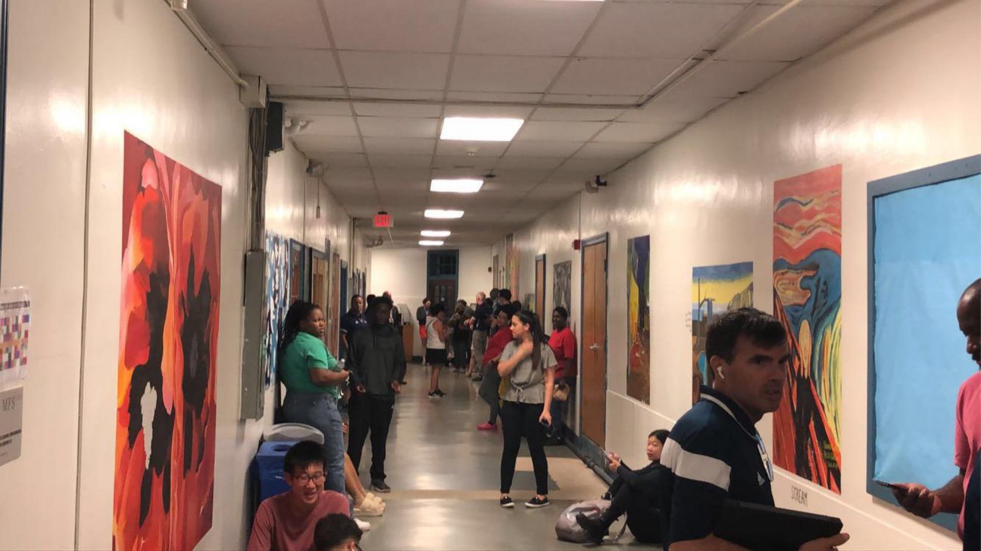 MFS students and faculty waiting out the tornado warning in the basement of the main building. Photo by Ari Smith ’25.