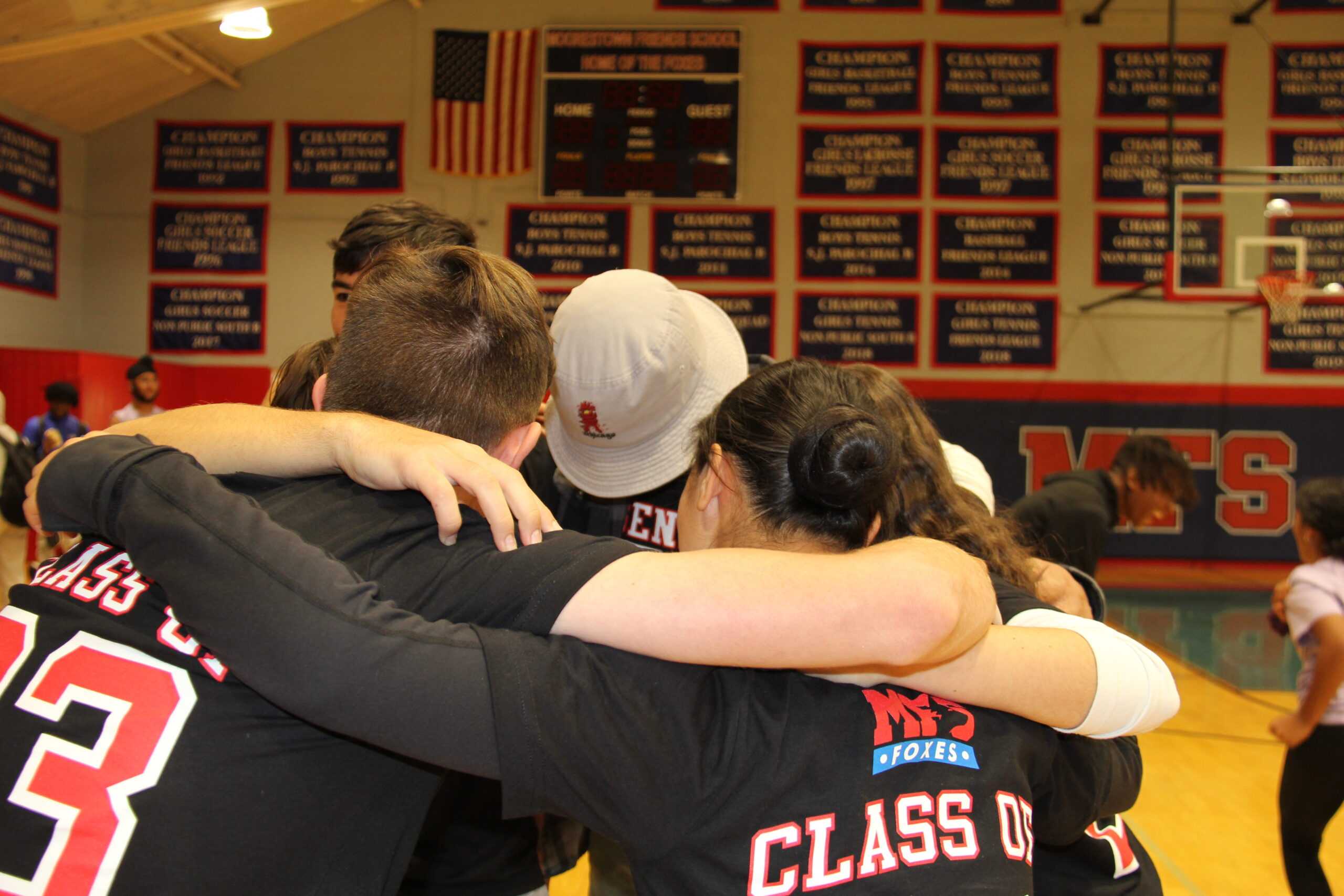 The Class of 2023 Eliminator team dons their T-shirts in a pregame huddle. Photo by Julia Tourtellotte ’23.