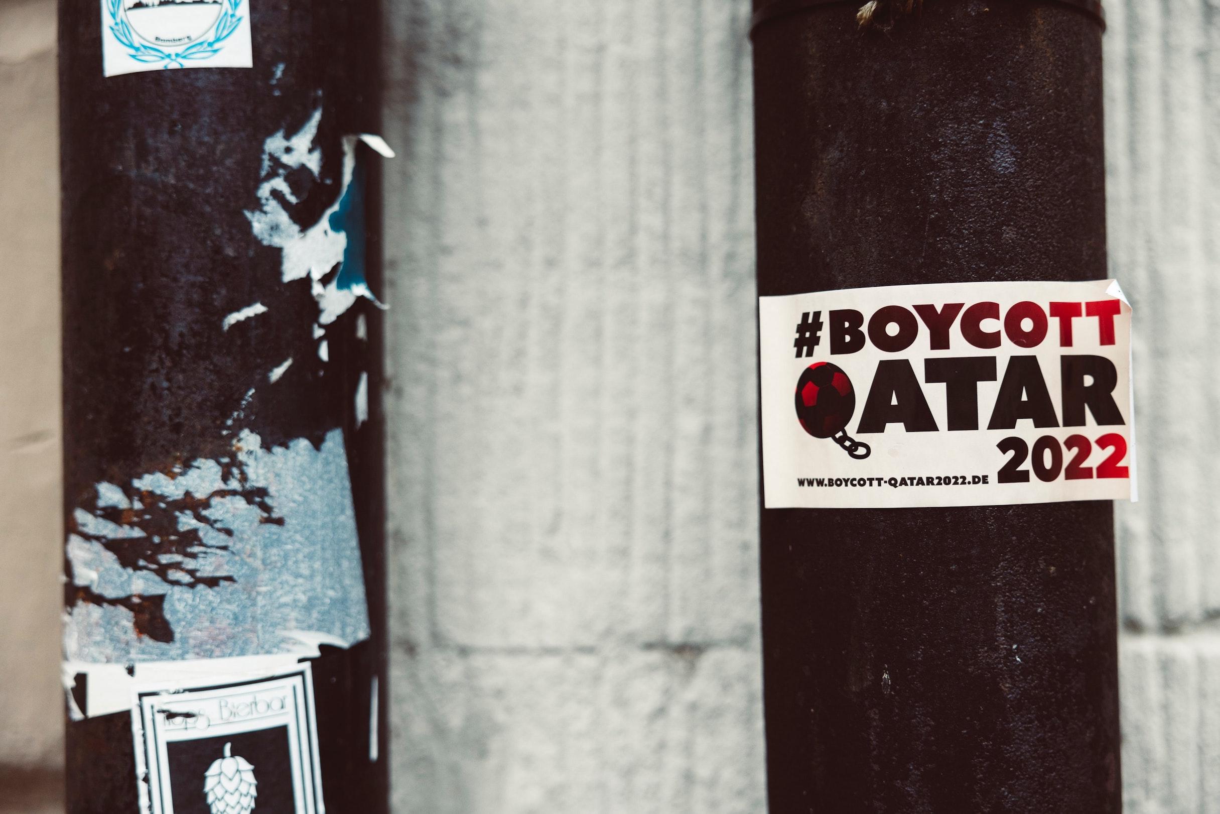 A sticker with the words “Boycott Qatar 2022” on it. Photo by Markus Spiske on Unsplash.