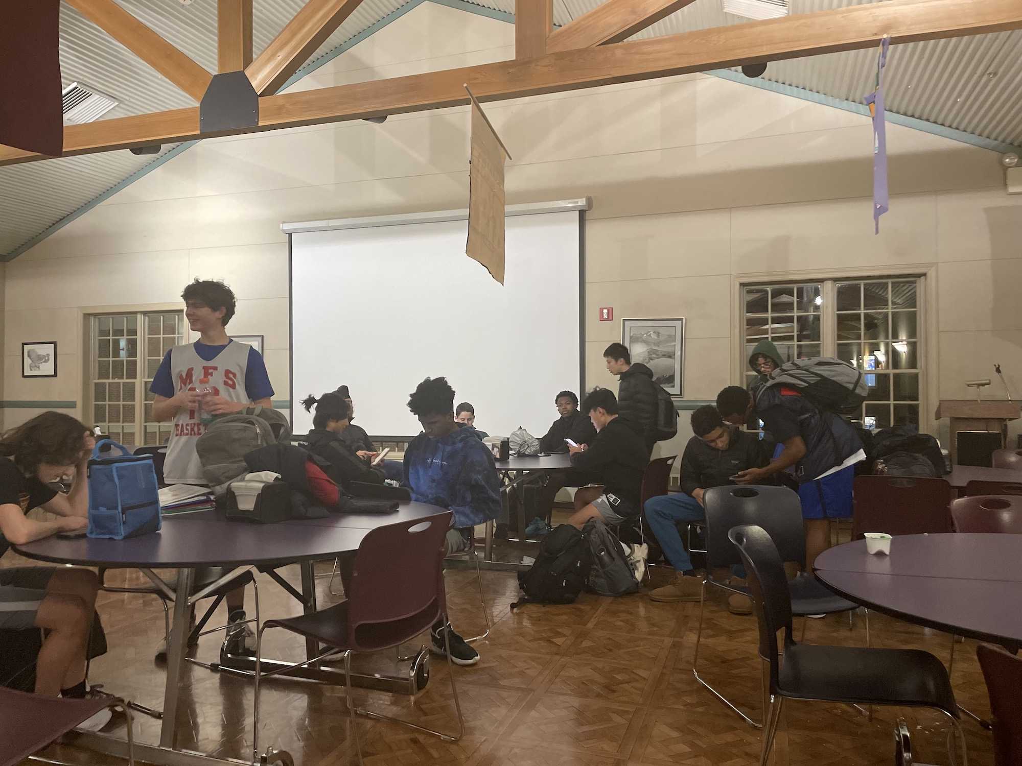 Students gather in the dining hall after being evacuated from the main building. Photo by Maya DeAndrea ’25.