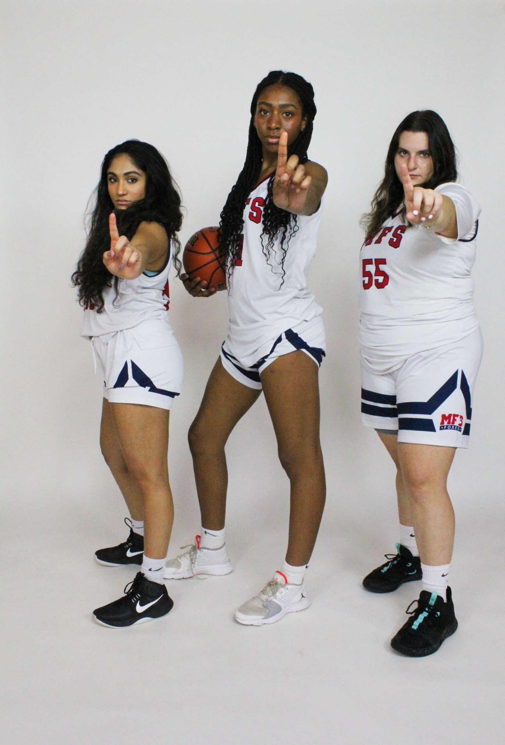 The seniors of girls’ basketball posing for Media Day. Photo by Elina Shah ’24