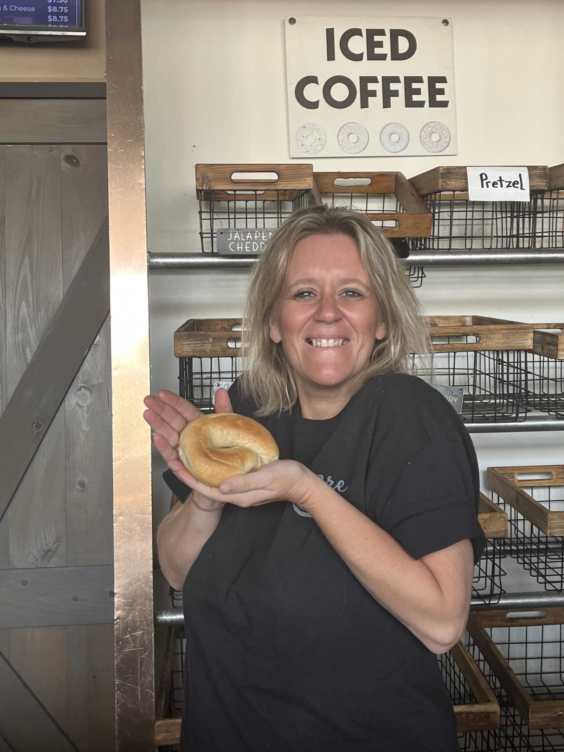 Mary Moore holding a bagel. Photo by Livia Kam ’26.