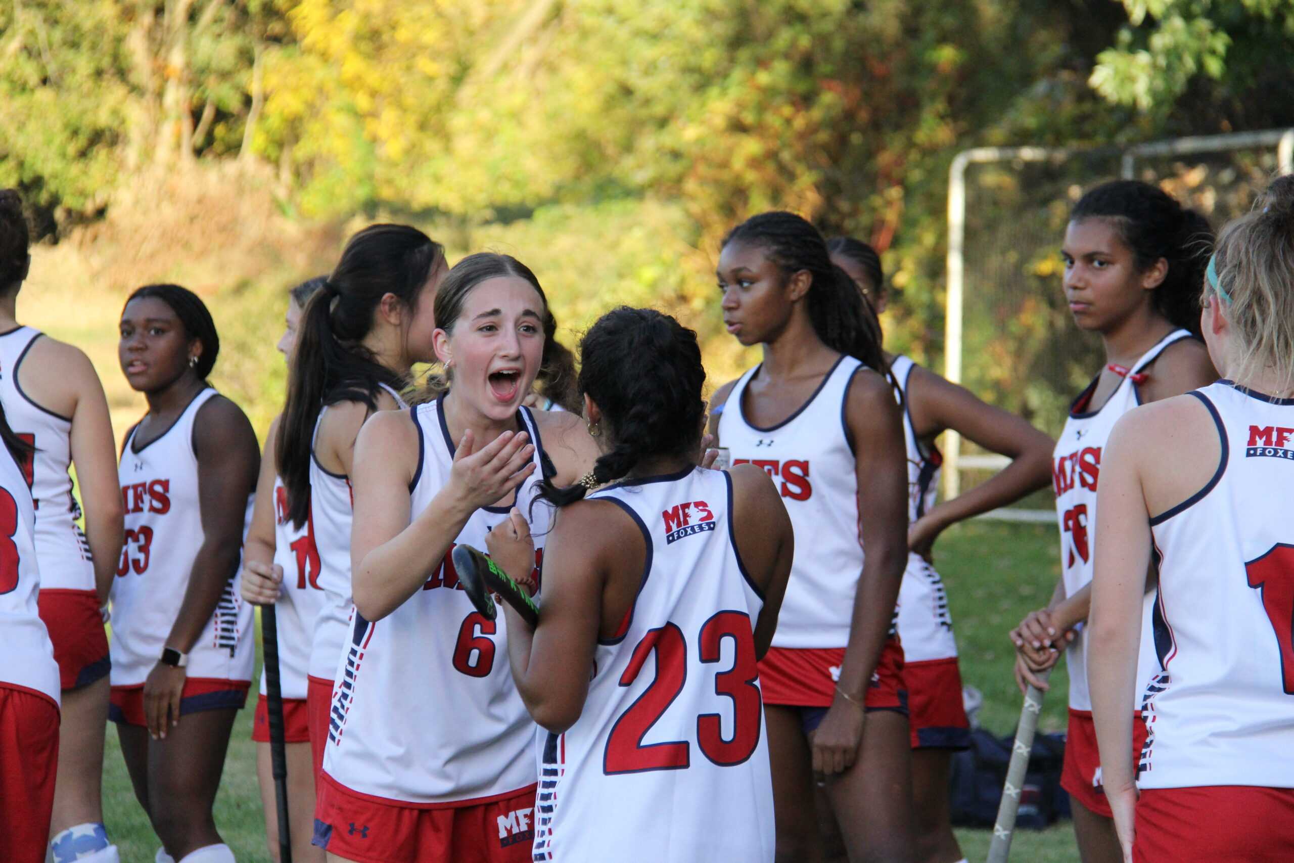 After their 1-0 win, Maya DeAndrea ’25 and Anjali Shah ’26 take in the fact that the team has won the Quaker Cup. Photo by Charlotte Nesevich ’25.