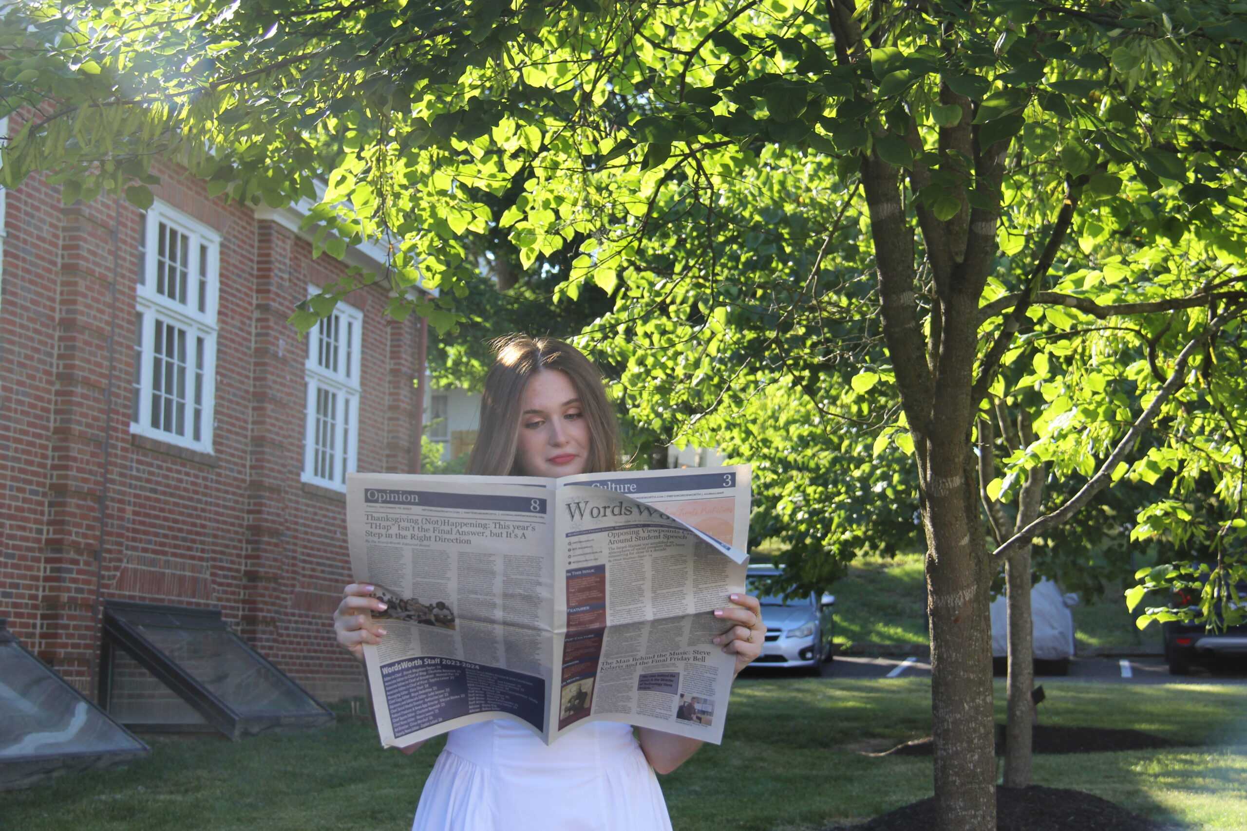 Dinah Megibow-Taylor '24 with a WordsWorth newspaper. Photo by MFS WordsWorth. 