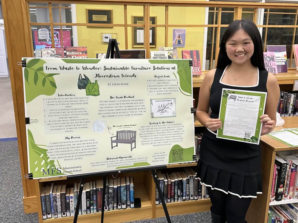 Sarah Huynh '25 with her Capstone poster. Photo from MFS SmugMug. 