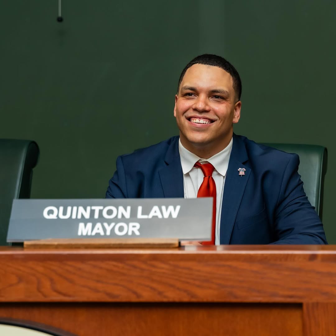 Quinton Law smiling at the Moorestown Town Hall in Council Chambers. Photo courtesy of Quinton Law. 
