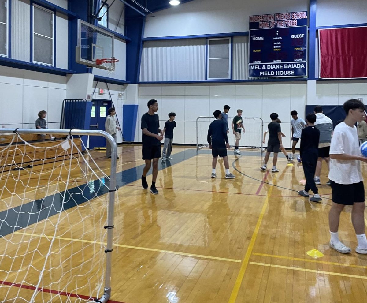 Students participating in a mini soccer match as part of the Boys Soccer team’s presentation. Photo by Aaron Linden ’28.