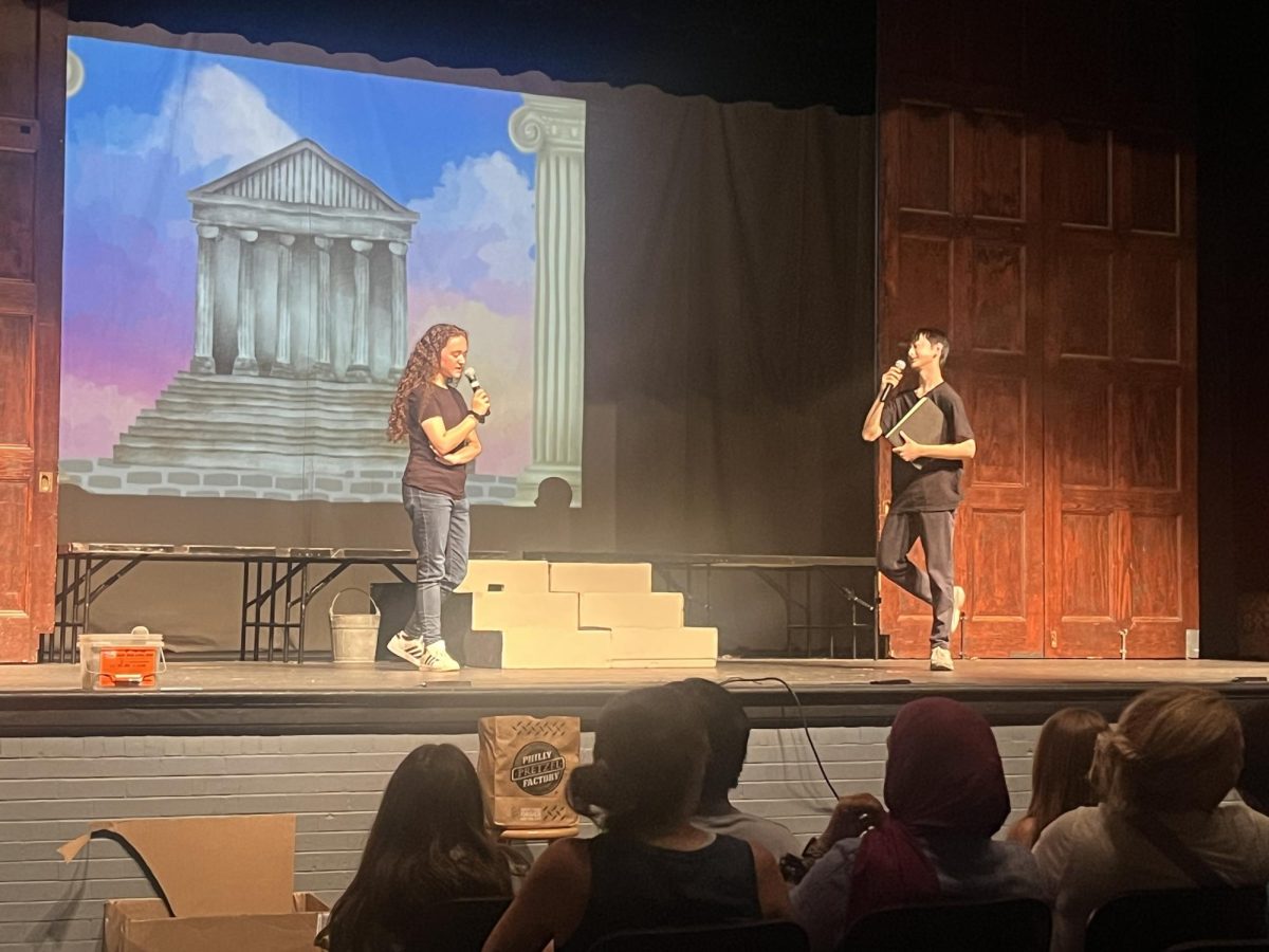 Ariel Steinberg ’26 and Jason Lin ’27 introduce the MFS Drama Club production of The Greek Mythology Olympiaganza. Photo by Keva Elie ’26.