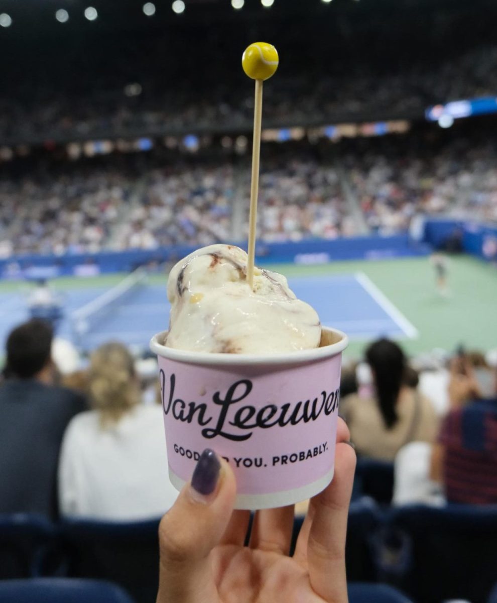 Emmie Huynh '27 eats Honeycomb Fudge Slam ice cream from Van Leeuwen while watching night session tennis at Louis Armstrong Stadium. Photo by Emmie Huynh ’27.
