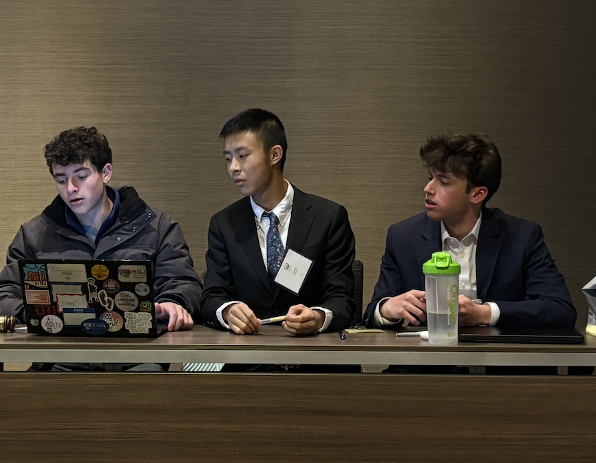 Ethan Cohen '26 in committee, listening to delegates. Photo by Emmie Huynh '27.