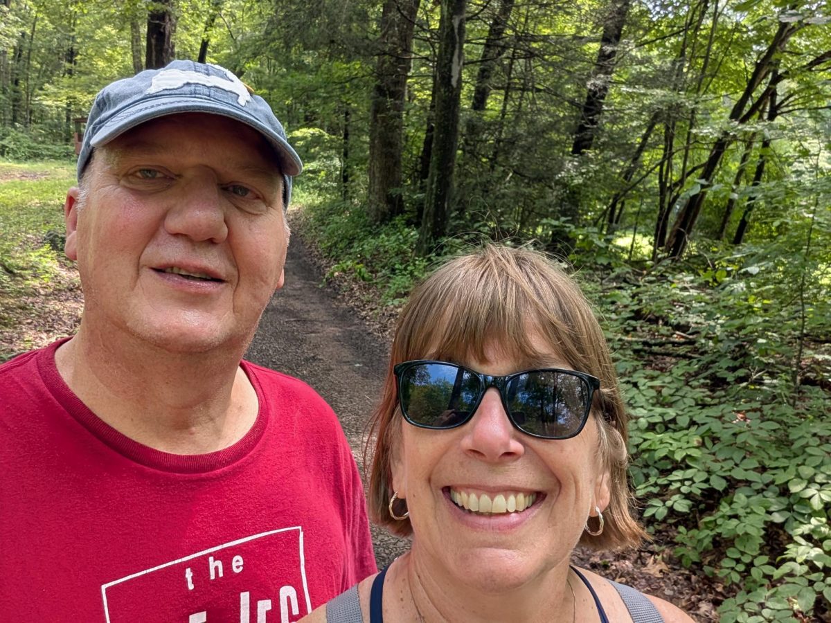 Ashlynne and Clark Thomson smile for the camera during a hike. Photo provided by Clark Thomson and Valerie Johnson.
