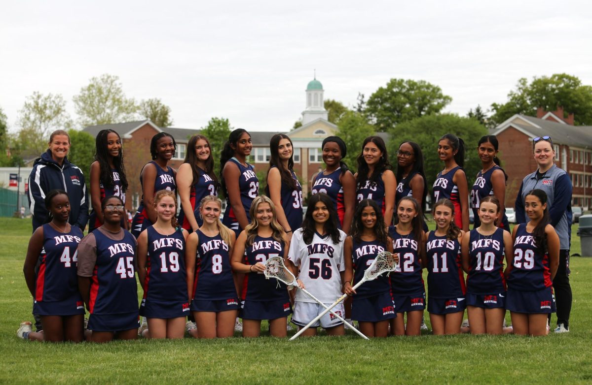 Girls varsity and junior varsity team photo. Photo by Mike Schlotterbeck.