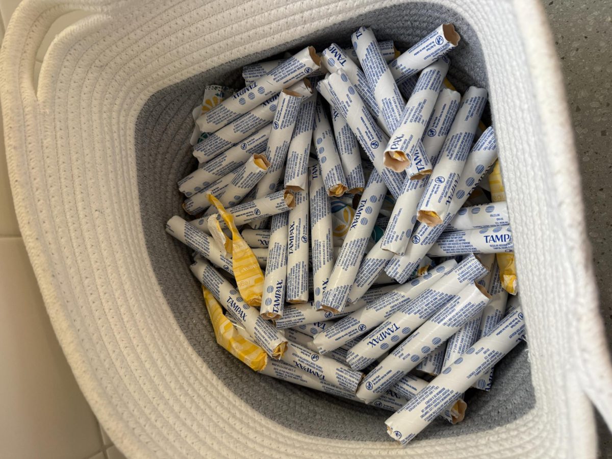 A school menstrual product basket containing exclusively tampons with cardboard applicators, which many students find uncomfortable, especially younger students. Photo by Anika Vasisth.
